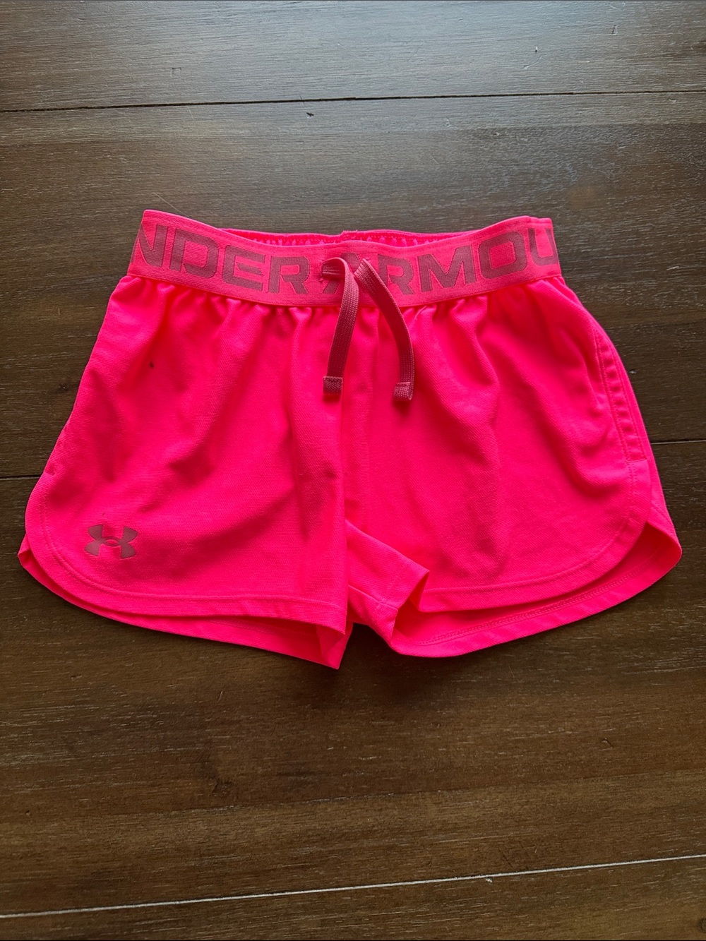 Size youth small (approx 7-8) Under Armour bright pink heatgear athletic shorts